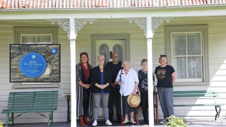 Inset, the Blue Plaque for Beryl McLaughlin. Main picture, from left, Trish Doyle MP, NSW Heritage Minister Penny Sharpe, Blue Mountains Historical society members Ross Ingram, Robyne Ridge, Fiona Burn and Fiona Cameron on the front porch of Tarella at Wentworth Falls. Pictures supplied