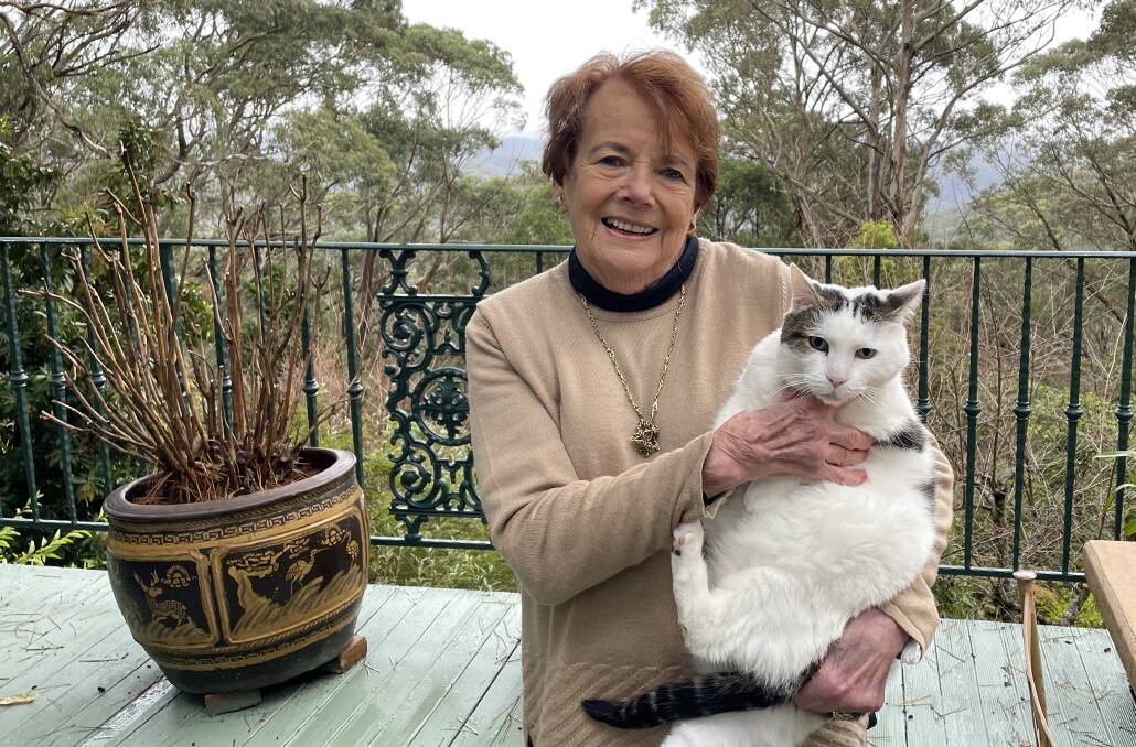 Mary Holt OAM and Timothy, her 11-year-old rescue cat, at her Mt Wilson home. Picture Jennie Curtin
