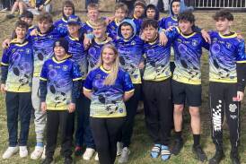 The Katoomba Devils under 15s, after being presented with their jerseys at the ceremony this morning at Katoomba Showground. Front centre is local woman Trish O'Bryan, who works at the Aboriginal Culture and Resource Centre and who designed this year's jersey. Picture supplied