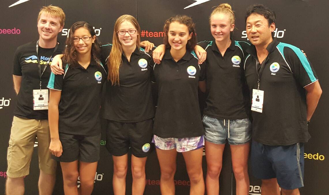 Glenbrook Swimming Club's girls 13-14 years relay team Kala Puri, Kelsey Otto, Brenna Tarrant and Claudia Neale, with coaches Corin Dobson (left) and  Kaz Suzuki (right).