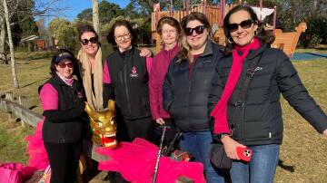 Blue Mountains MP Trish Doyle, second from left, Ward 2 Cr Claire West and deputy mayor Romola Hollywood, far right, with members of Dragons Abreast Blue Mountains. Picture supplied