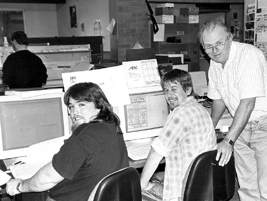 Blue Mountains Gazette founding editor Mick Ticehurst, right, with former Blue Mountains Gazette production staff Scott Drury and Andrew Buckle at the Gazette's Springwood office in the 1980s.