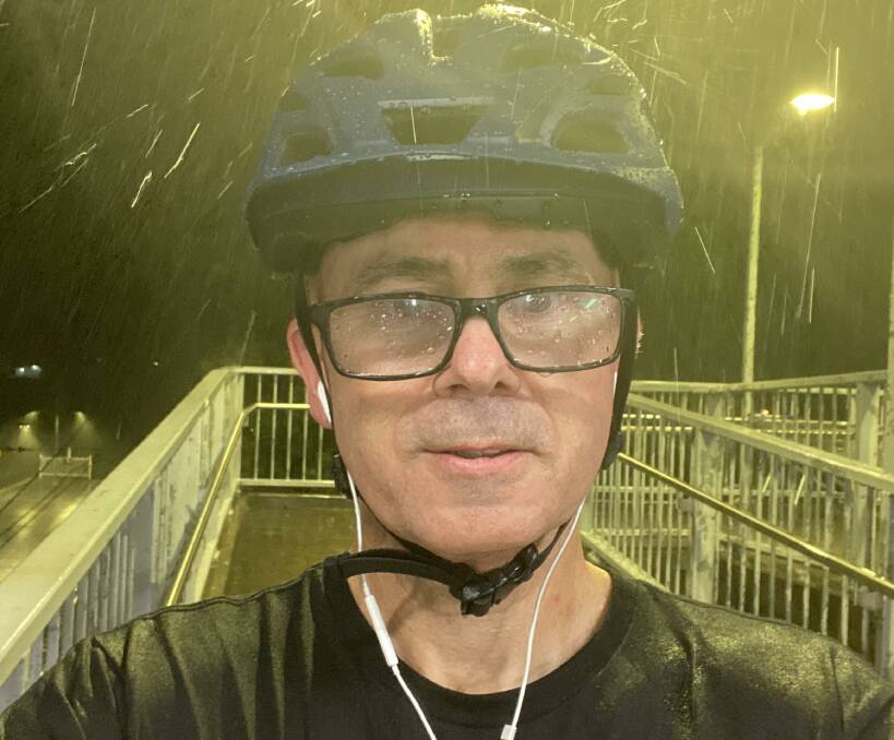 Blue Mountains mayor Mark Greenhill hasn't let the wet weather deter him from his cycling fundraiser for Camp Quality.