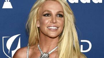Pop singer Britney Spears says she injured her foot and denies reports of having a breakdown. (AP PHOTO)