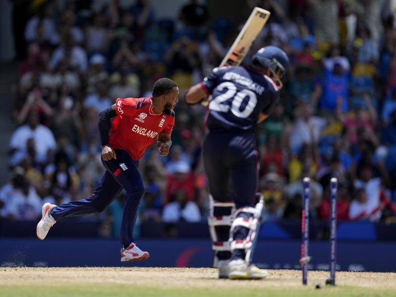 Chris Jordan bowls Saurabh Nethralvakar to complete a hat-trick in England's thrashing of the US. (AP PHOTO)