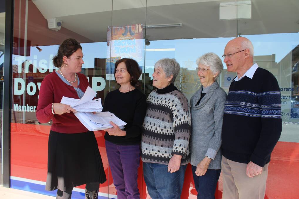 Trish Doyle MP receives the 'Save our LEP' petition from Blue Mountains Conservation Society representatives Kerry Horne, Carolyn Williams, Anne Cantwell and Bob Cantwell outside her electorate office in Springwood.